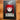 DEADGRACE soft enamel pin in its clear sleeve on its backing card