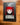 DEADGRACE soft enamel pin in its clear sleeve on its backing card